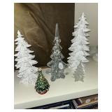Four glass Christmas trees