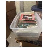 Large plastic box full of old sheet music