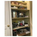 Cabinet full pots and pans, baking dishes