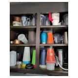 Cabinet full of miscellaneous glasses, plastic