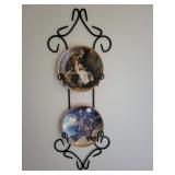 Norman Rockwell plates and iron wall display