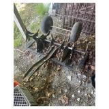 Garden pull behind aerator