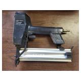 Cordless central pneumatic air nailer