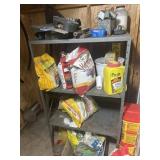 Metal shelf with garden supplies
