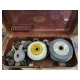 Metal box full of grinding stones