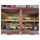 Various dial indicators in cabinet