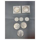 Five Ike dollar coins 1971D, 1971D, 1974D, 1972,