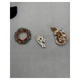 Three brooches one AJC mark