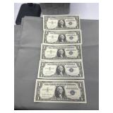 Five 1957 one dollar silver certificates - Four