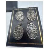 Four Egyptian god pendants