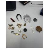 Safety, patrol badge, horseshoes, small knife,