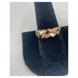 14 karat gold ring with various stones