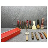Putty and carpet knives and red container