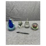 Four Paperweights