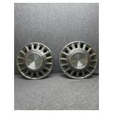 Two Ford Mustang hubcaps