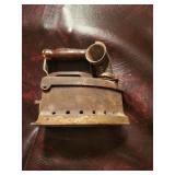 Early steam powered flat iron
