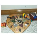 Game with golf tees, puzzles, Rubiks cube