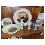 Shelf of collectibles:  plates, vase, etc.