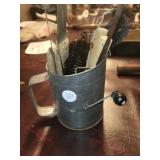 Sifter with various tools - brushes, butcher