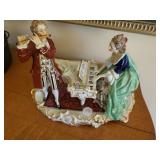 Figurine piano with flute player