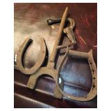 Antique iron stirrup  and an old iron horseshoe