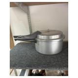 Pressure cooker with do-dad inside