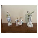 Two eight inch 1 five inch old England figurines