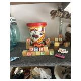 Bucket with wood blocks and toy cars
