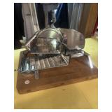 Meat slicer on wooden block