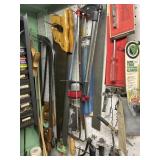 Various tools hanging on pegboard meat, sauces,