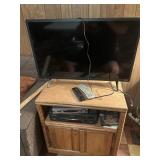 32' Flatscreen TV, VHS TV stand and tapes