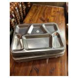 Heavy stack of metal lunch trays