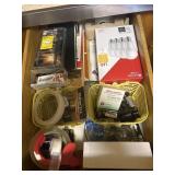 2 drawers:  batteries, light bulbs, dish towels,