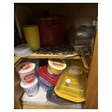 Cabinet full of plastic servingware and baking