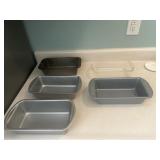 Four metal bread, making pans one fire king g