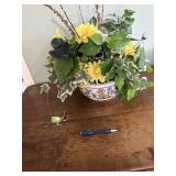 Blue and white planter with flowers