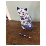 Blue and white cat figurine