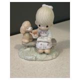 Precious moment, little girl with a puppy