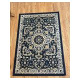 Two area rugs - 56x 40 and 62x84