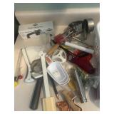 Plastic container full kitchen utensils
