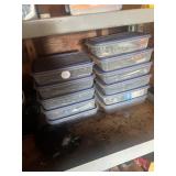 Several plastic containers with nuts, screws,