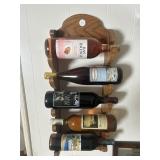 Wine rack, and five bottles