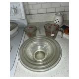 Three clear Pyrex, mixing bowls and two m