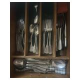 Two drawers of silverware and knives