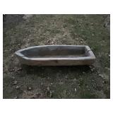 Wooden trough carved out like a canoe