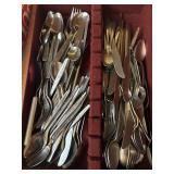 Wooden container full silverware