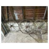 Three metal wagon wheels