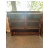 Wooden cabinet top with glass doors