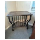 Metal based magazine rack table