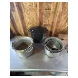 Several large cooking pots